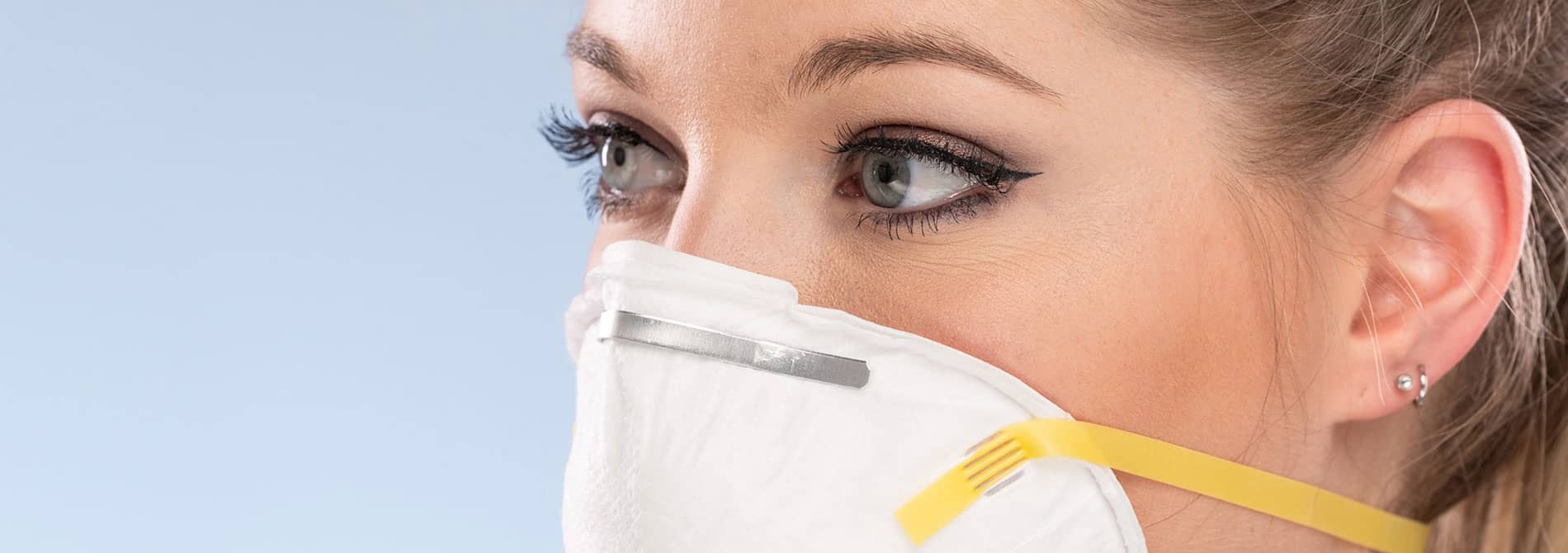 Woman with a surgical mask on